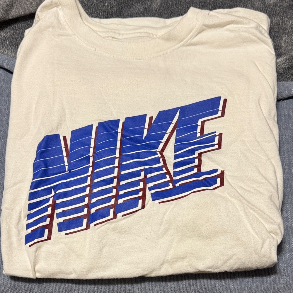 Nike Beige Tee with Striped Blue Logo
